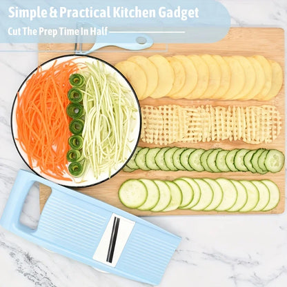Blue compact vegetable slicer beside sliced cucumber, potato, carrot, and waffle-cut vegetables
