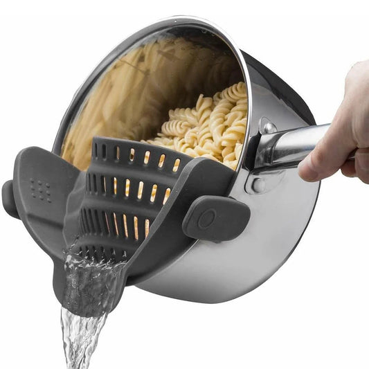 Clip-on silicone pot strainer attached to the rim of a cooking pot